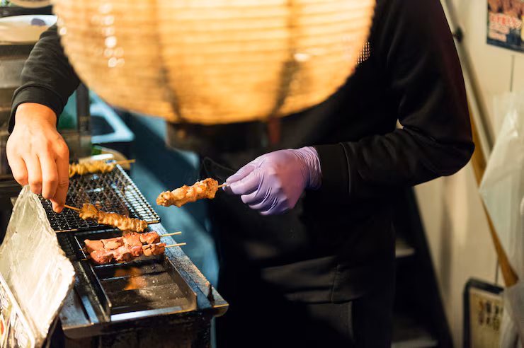 chef-preparing-tasty-japanese-food-grill_23-2148759565